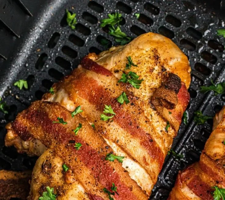 Delicious air fryer bacon wrapped chicken served on a plate