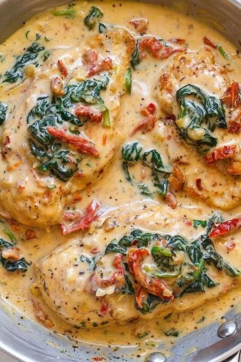 Juicy chicken breasts cooked with spinach in a creamy Parmesan sauce
