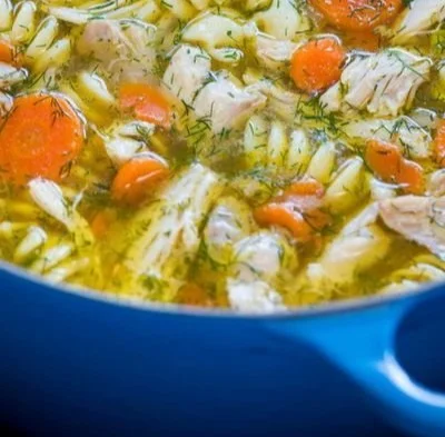 Bowl of classic chicken noodle soup with vegetables and noodles