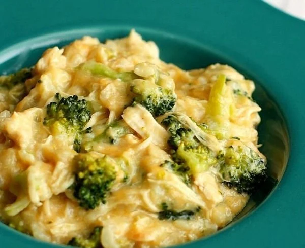 Creamy cheesy chicken broccoli rice dish garnished and ready to serve