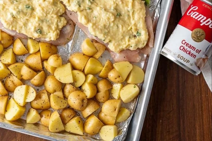 Creamy chicken sheet pan dinner with vegetables, perfect for a quick weeknight meal.