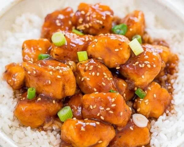 Easy and quick 15-minute sweet and sour chicken served on a plate.