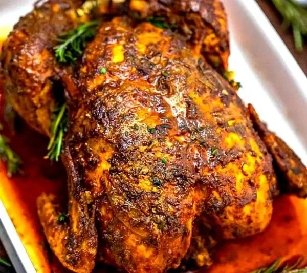 Succulent Garlic Herb Butter Roasted Chicken served on a platter