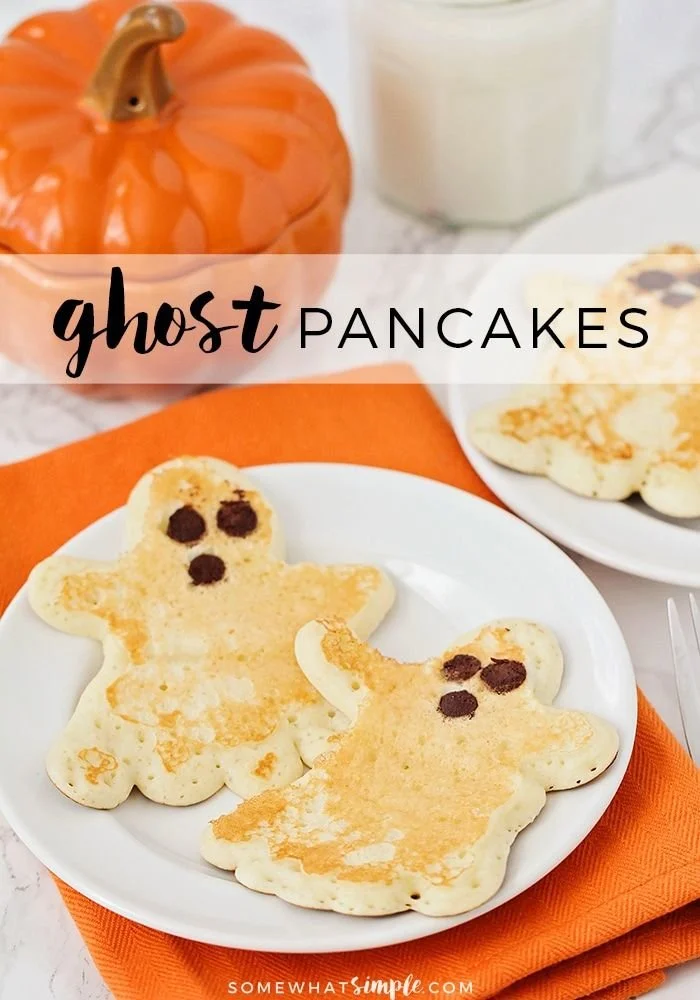 Plate of Halloween ghost pancakes with spooky designs for festive breakfast