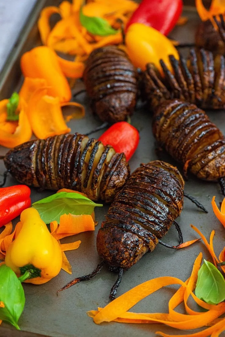 Hasselback Potato served with toppings from Nibbles and Feasts