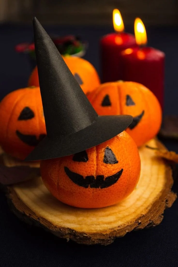 Healthy Halloween fruit snacks featuring spooky decorations and Halloween-themed fruits.