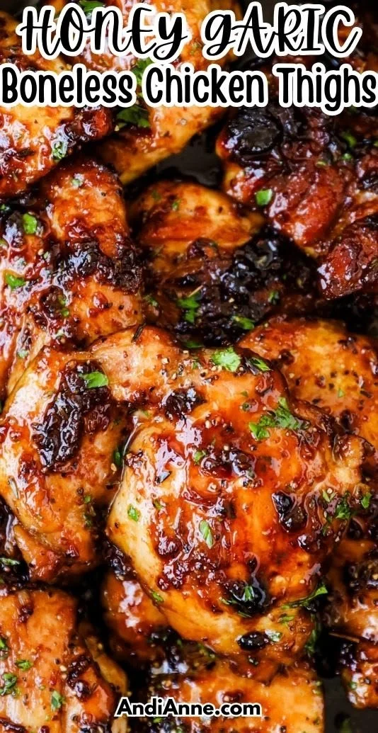 Juicy honey garlic boneless chicken thighs plated with fresh herbs and vegetables