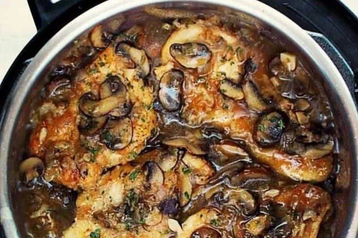 Saucy Instant Pot Chicken Marsala served with mushrooms and herbs