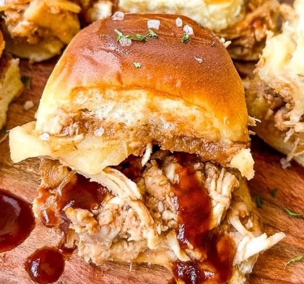 Delicious shredded chicken BBQ sliders served on a platter
