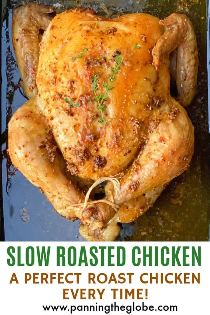 Perfectly slow roasted chicken showcasing golden-brown skin and juicy meat.
